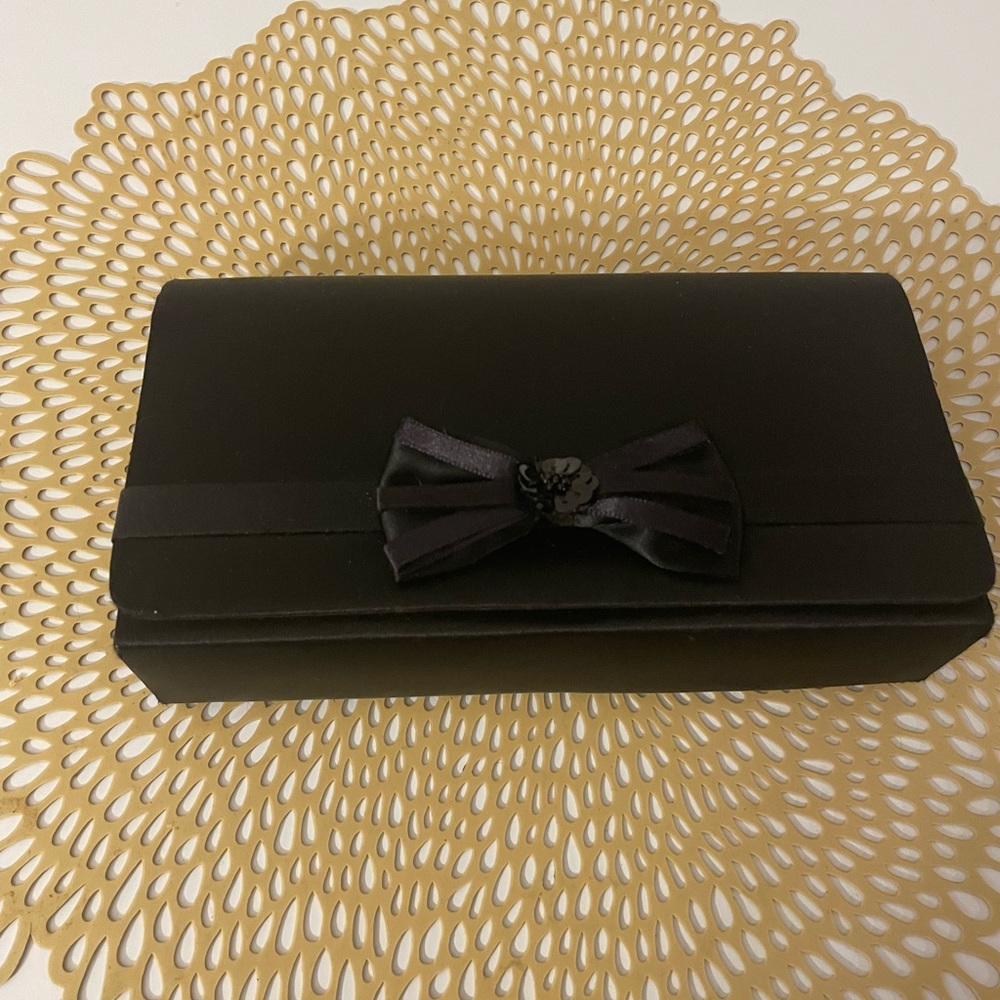 Black satin clutch bag with string by La regale. Great condition.